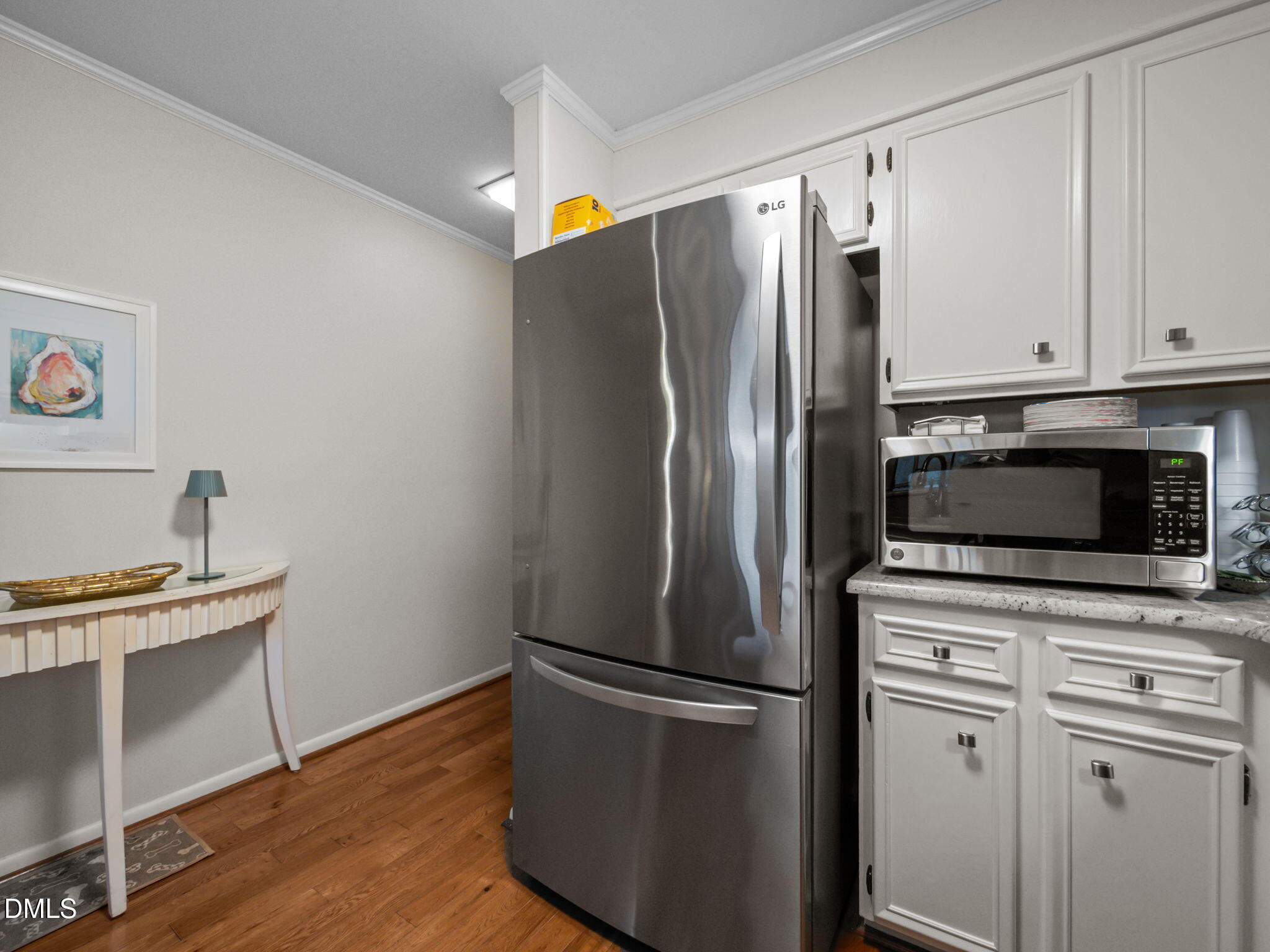 2308 West Fort Macon Road, Unit 204H Atlantic Beach, NC 28512 - Photo 12 of 83 a kitchen with stainless steel appliances a refrigerator microwave and sink