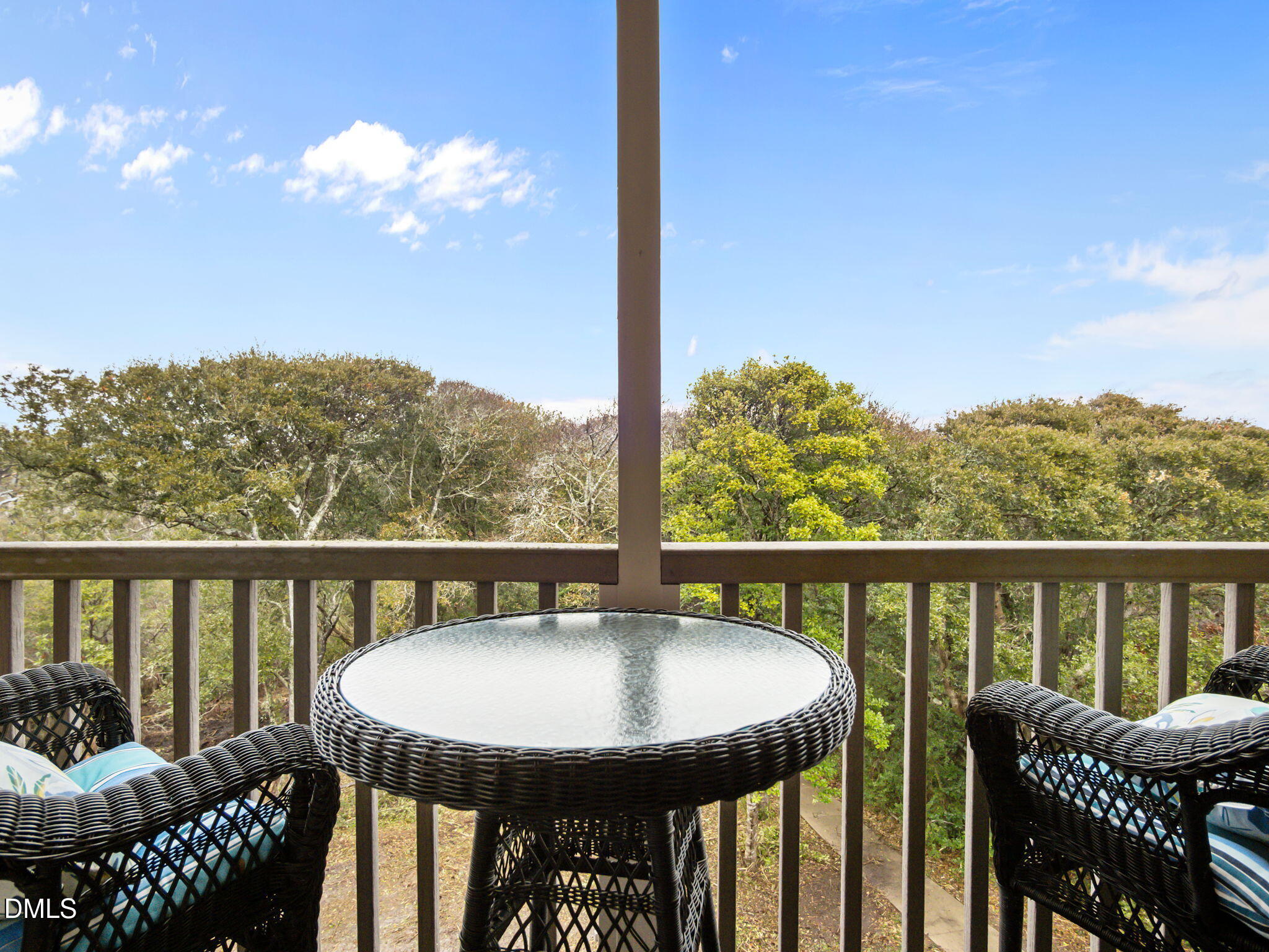 2308 West Fort Macon Road, Unit 204H Atlantic Beach, NC 28512 - Photo 26 of 83 a view of a balcony with a table and chairs