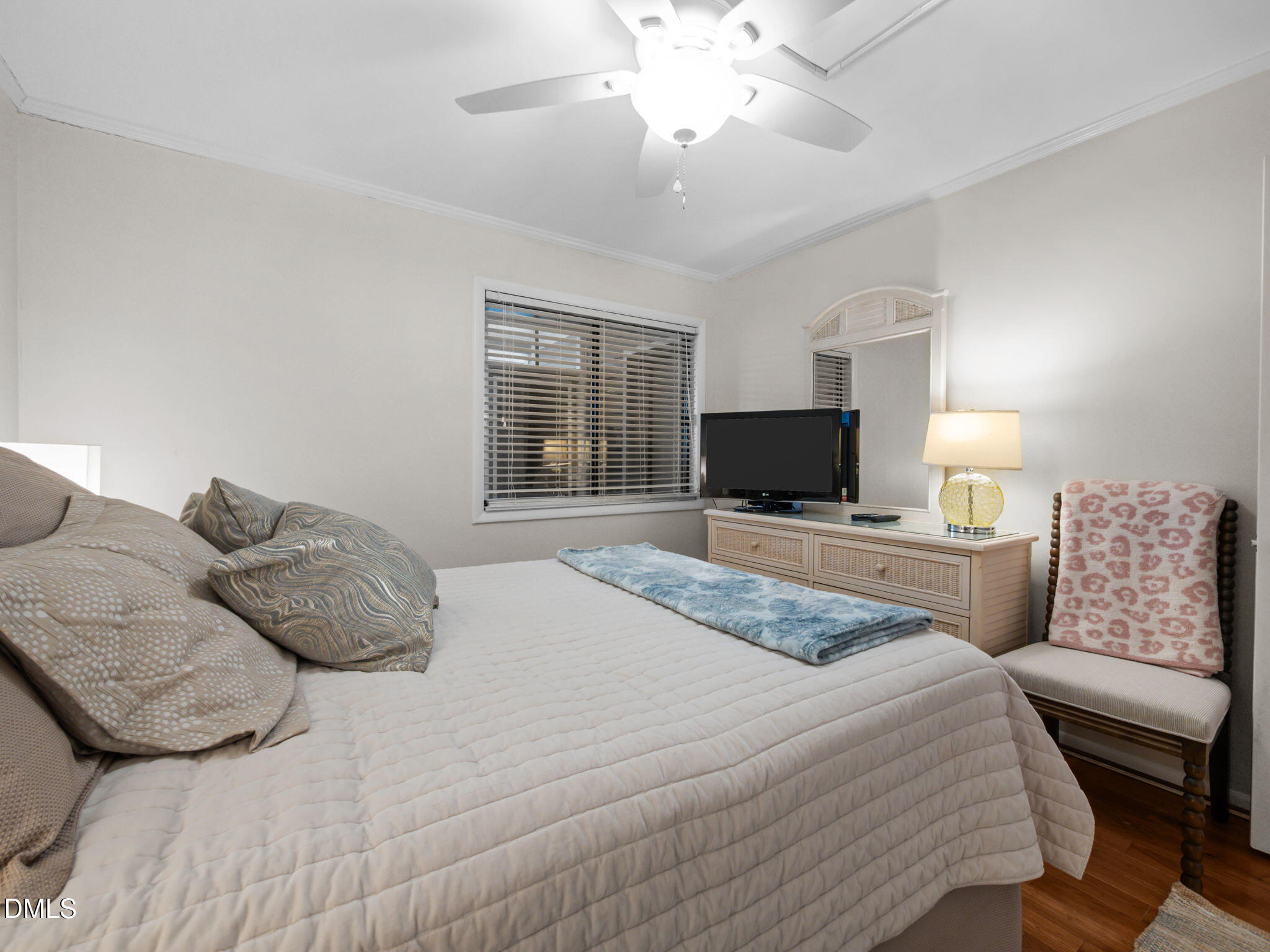 2308 West Fort Macon Road, Unit 204H Atlantic Beach, NC 28512 - Photo 31 of 83 a bedroom with a large bed and a tv