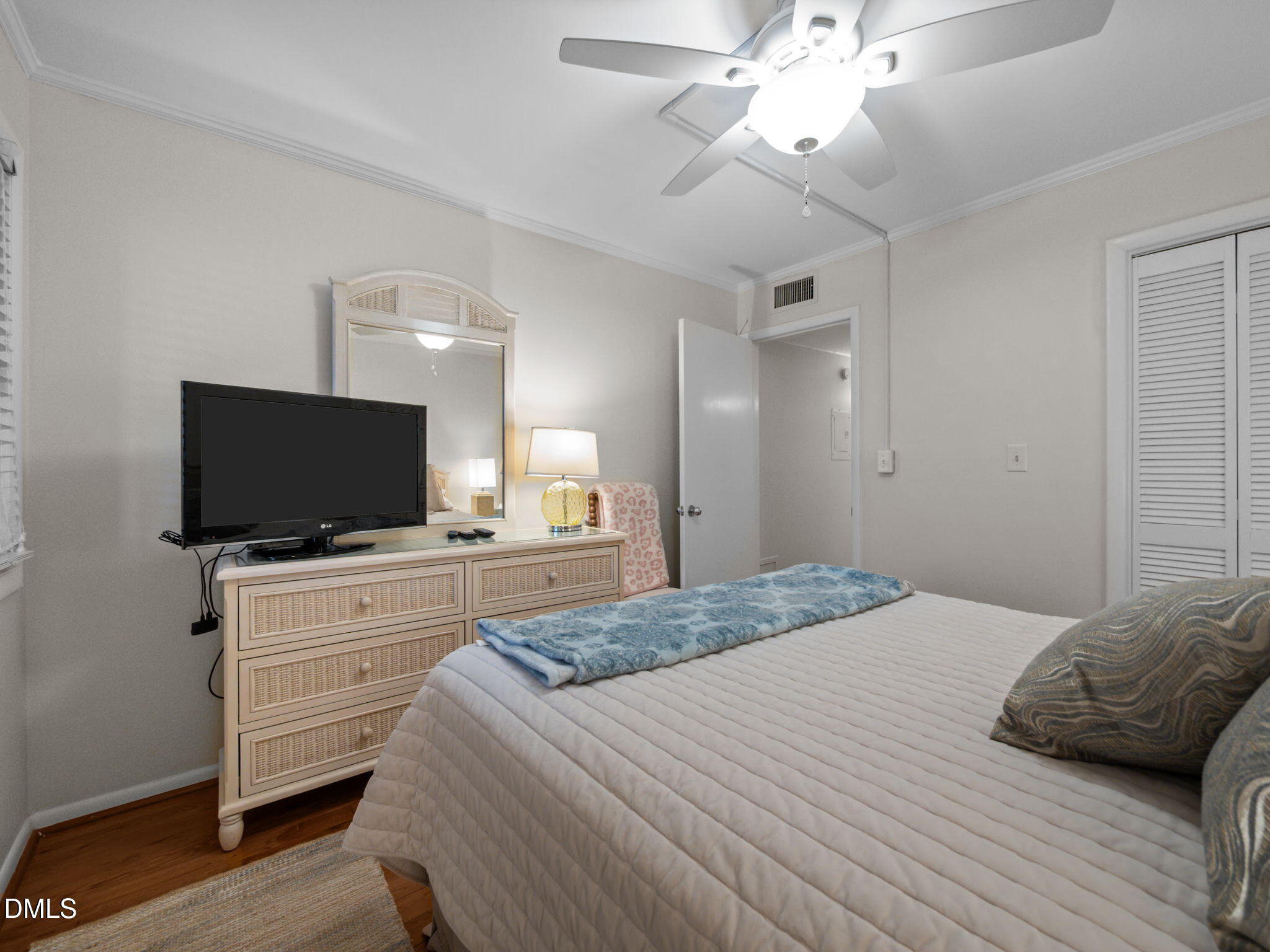 2308 West Fort Macon Road, Unit 204H Atlantic Beach, NC 28512 - Photo 33 of 83 a bedroom with a bed and a flat screen tv