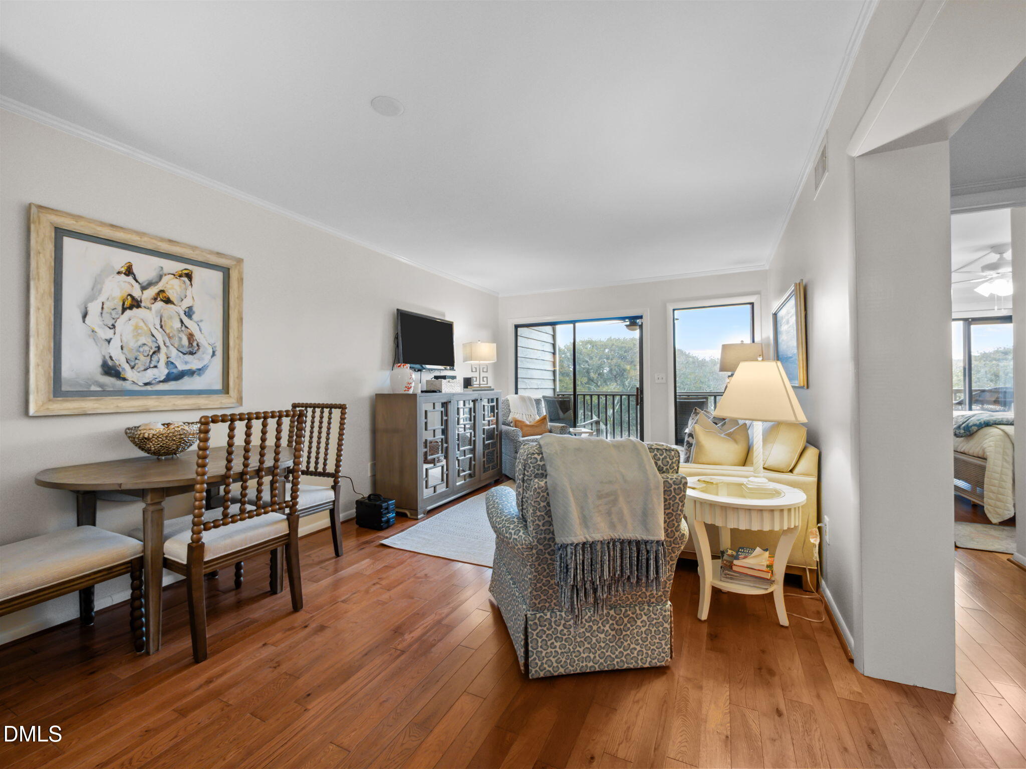 2308 West Fort Macon Road, Unit 204H Atlantic Beach, NC 28512 - Photo 7 of 83 a living room with furniture and a wooden floor