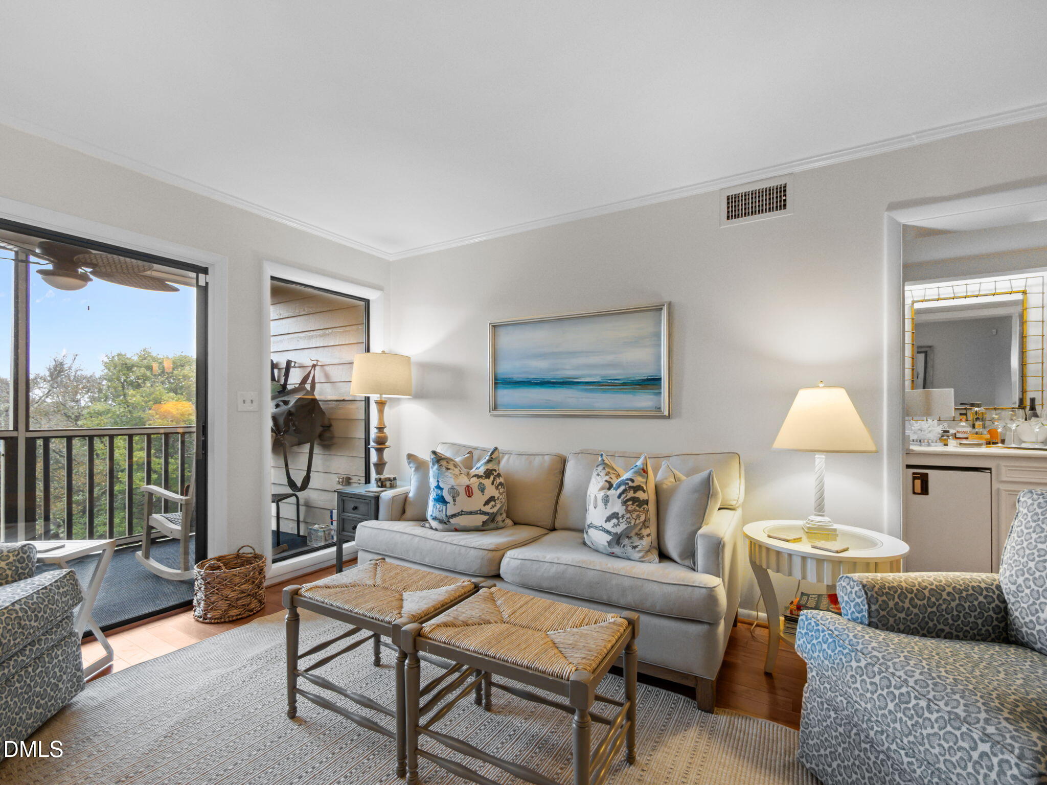 2308 West Fort Macon Road, Unit 204H Atlantic Beach, NC 28512 - Photo 8 of 83 a living room with furniture and a lamp