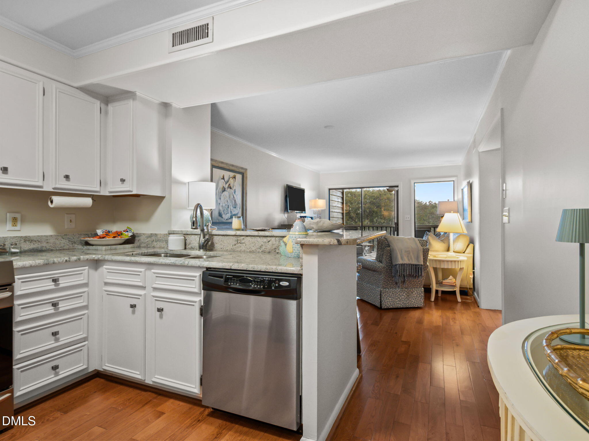2308 West Fort Macon Road, Unit 204H Atlantic Beach, NC 28512 - Photo 10 of 83 a open kitchen with white cabinets and stainless steel appliances