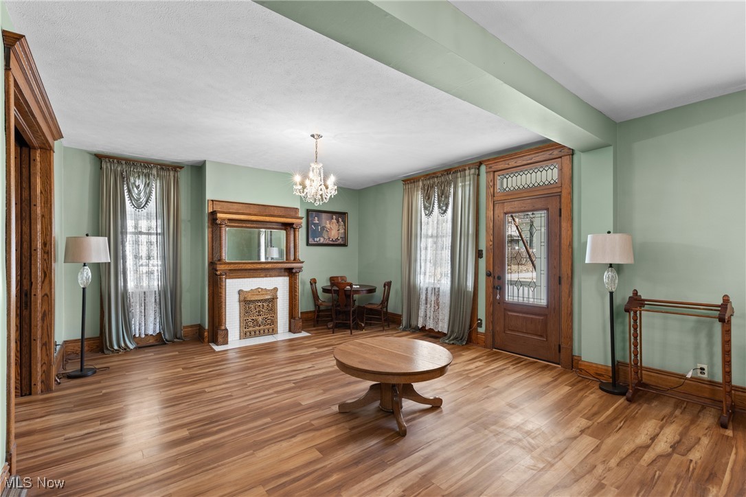 1011 Parriott Avenue Moundsville, WV 26041 - Photo 5 of 44 Foyer entrance featuring a chandelier, wood finished floors, and healthy amount of natural light