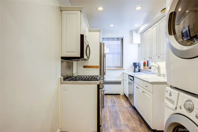 a kitchen with a stove a sink and a refrigerator