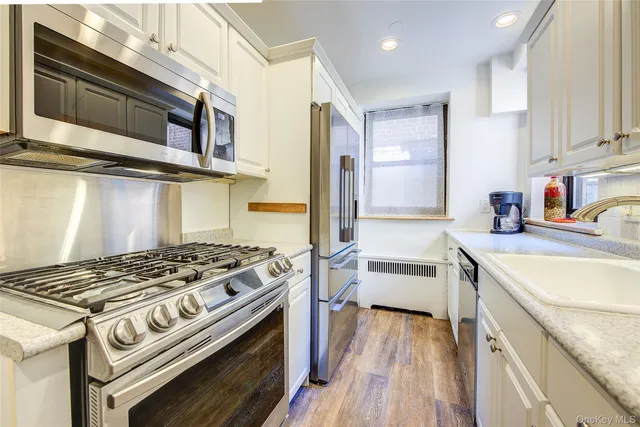 a kitchen with a stove and a sink