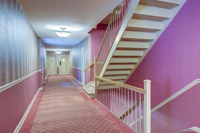 a view of a hallway with staircase