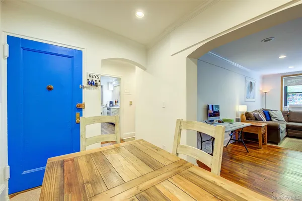 a bedroom with a bed and a view of kitchen