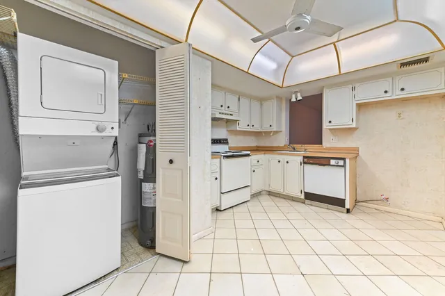a kitchen with cabinets and appliances