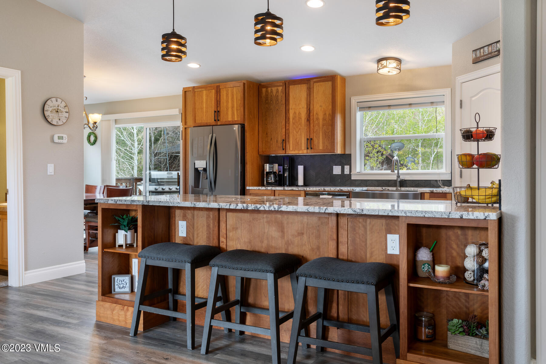 376 Blacksmith Road Eagle, CO 81631 - Photo 12 of 32 a kitchen with a table chairs sink and cabinets