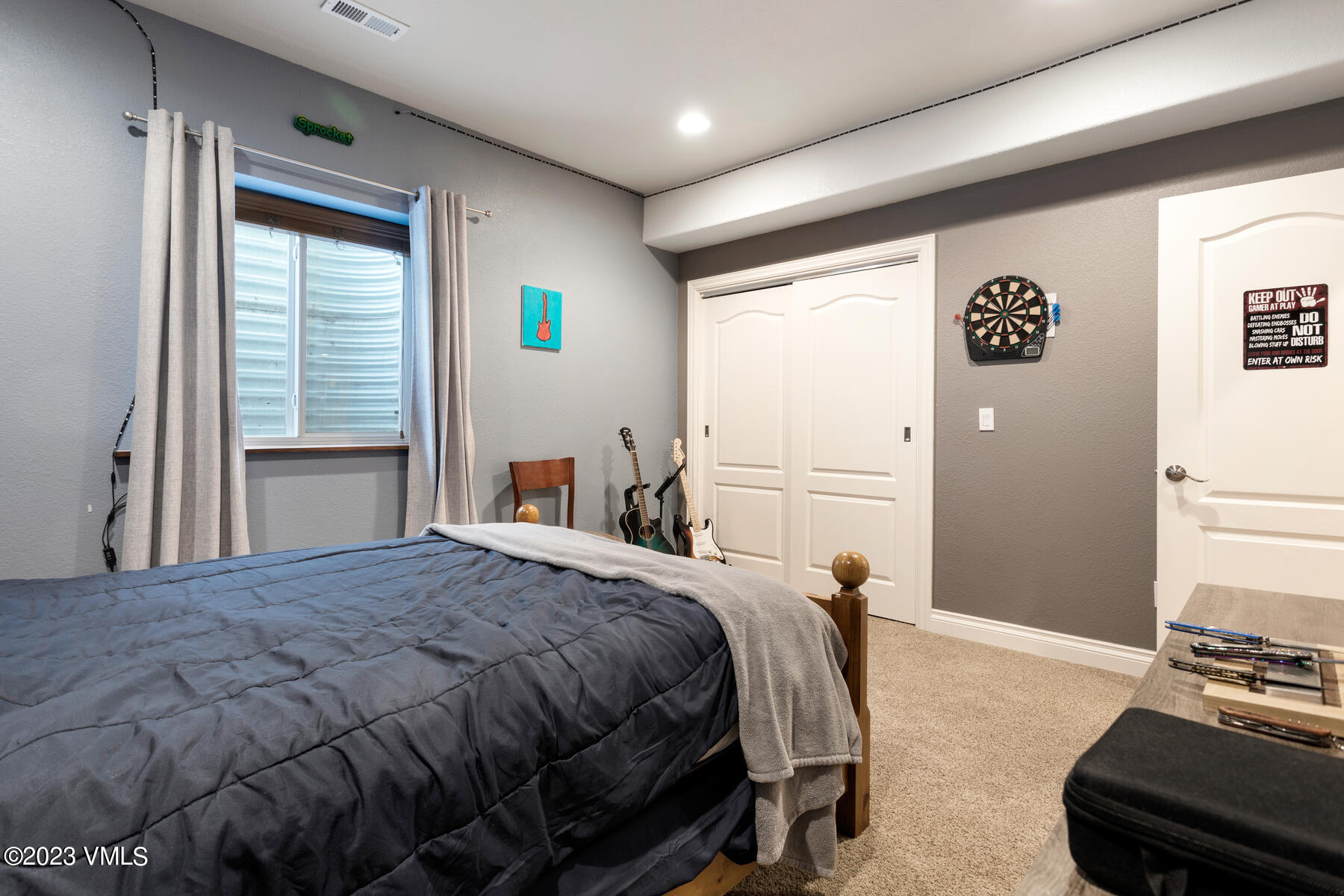 376 Blacksmith Road Eagle, CO 81631 - Photo 19 of 32 a bedroom with a bed and a window
