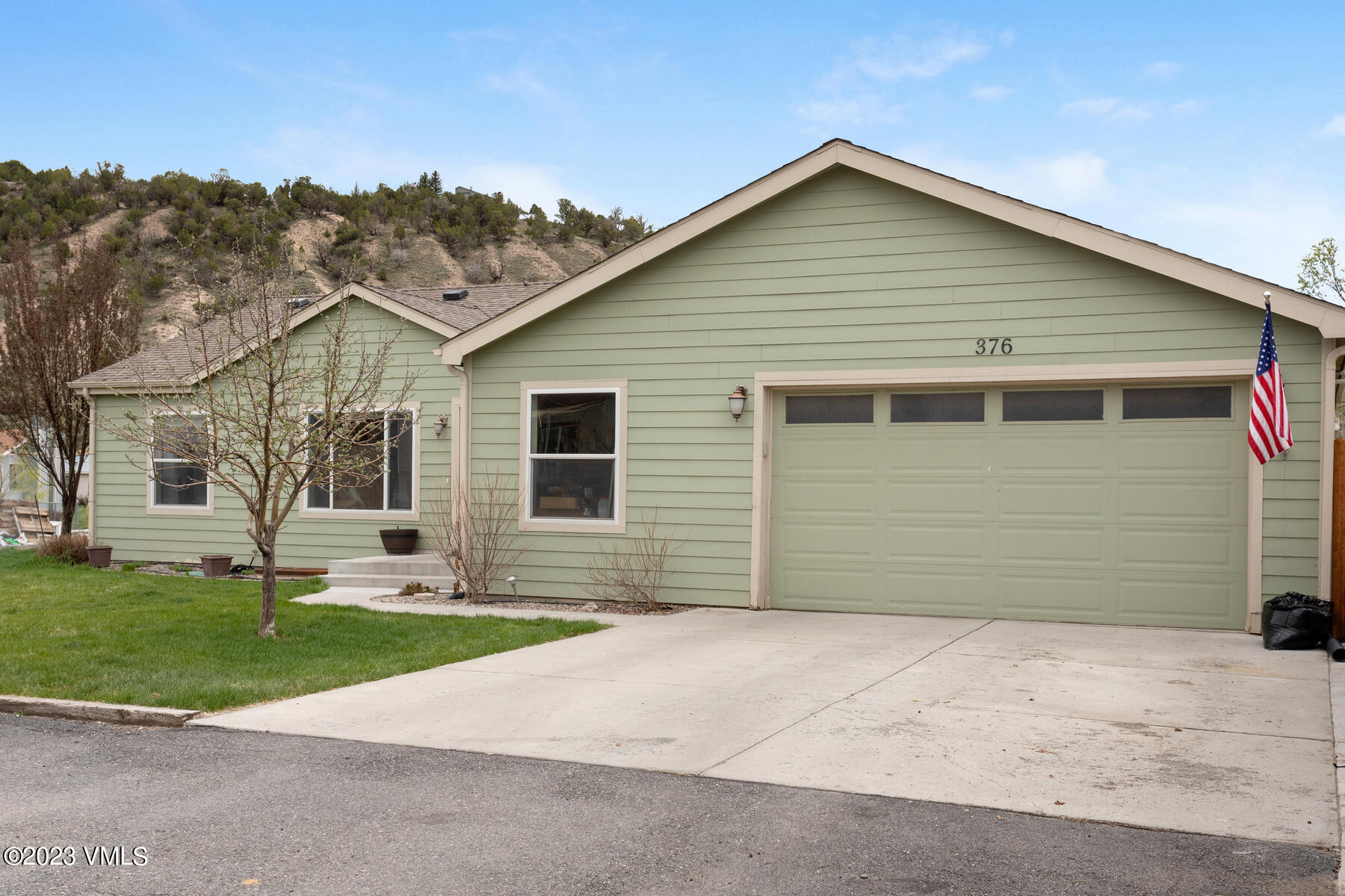 376 Blacksmith Road Eagle, CO 81631 - Photo 3 of 32 a front view of a house with a yard and garage