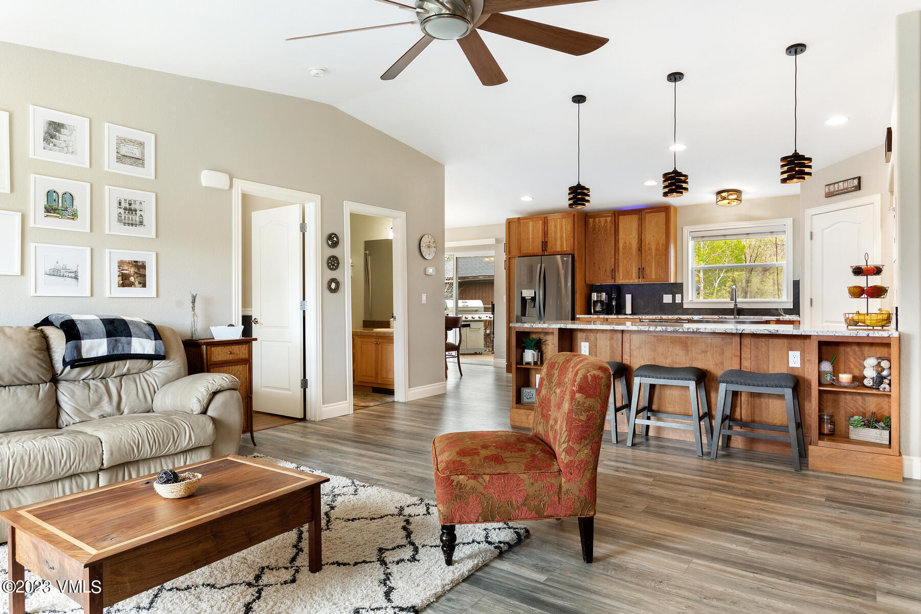 376 Blacksmith Road Eagle, CO 81631 - Photo 6 of 32 a living room with furniture kitchen view and a chandelier