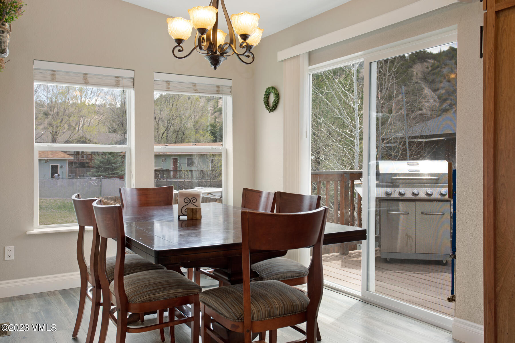 376 Blacksmith Road Eagle, CO 81631 - Photo 7 of 32 a dining room with furniture a chandelier and wooden floor