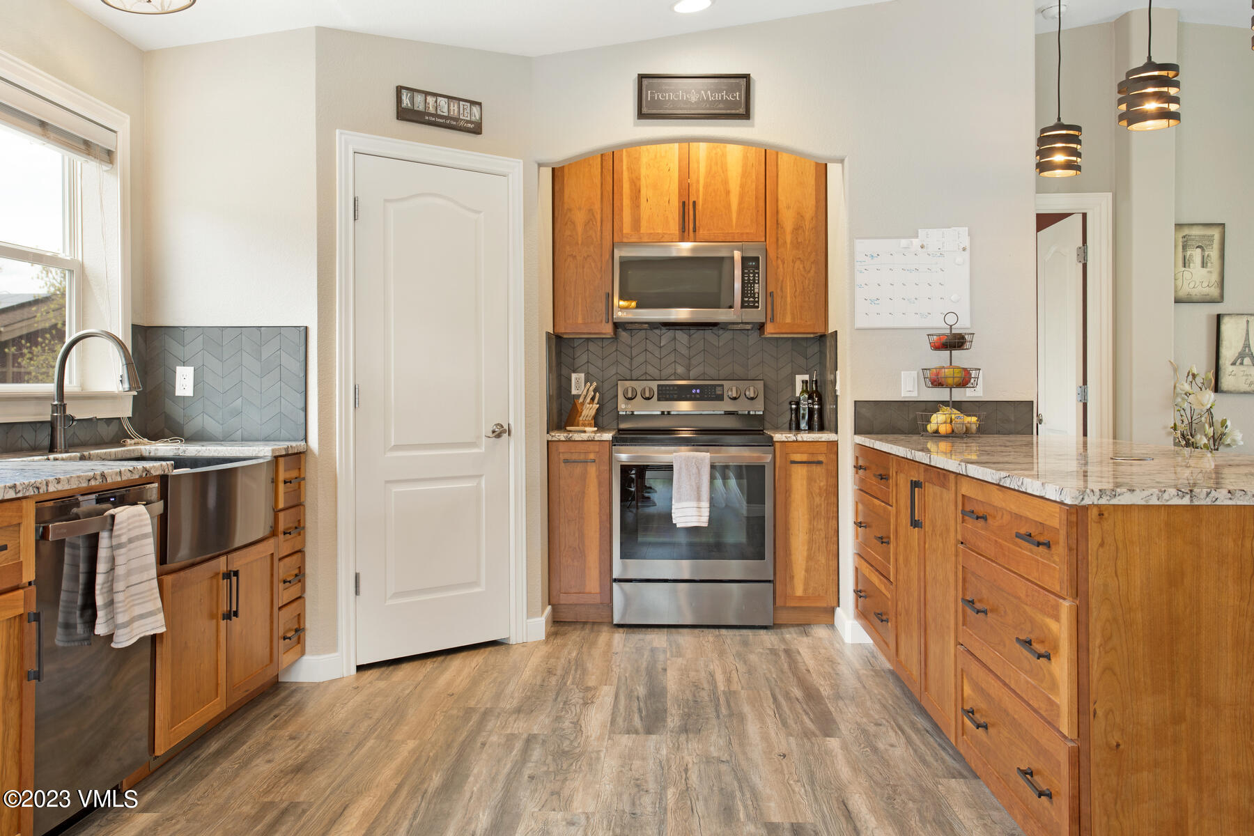 376 Blacksmith Road Eagle, CO 81631 - Photo 10 of 32 a kitchen with stainless steel appliances a stove top oven and a refrigerator