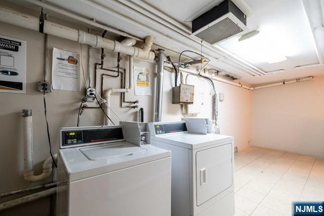 141 Park Avenue, Unit 8A East Rutherford, NJ 07073 - Photo 17 of 22 a view of storage and utility room with washer and dryer