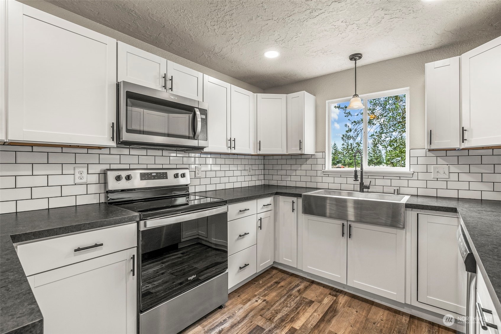 1541 Sightly Road Toutle, WA 98649 - Photo 6 of 30 a kitchen with cabinets stainless steel appliances and a sink