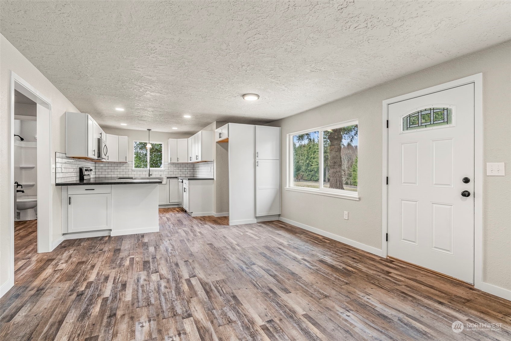 1541 Sightly Road Toutle, WA 98649 - Photo 8 of 30 a view of kitchen with wooden floor and electronic appliances
