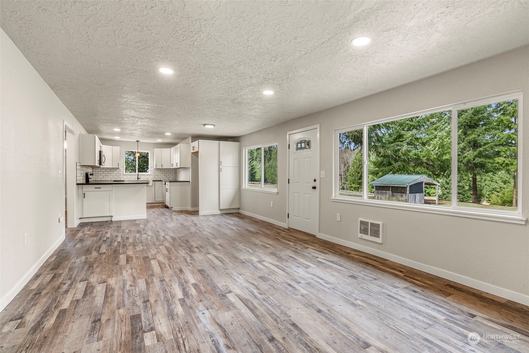 1541 Sightly Road Toutle, WA 98649 - Photo 9 of 30 a view of empty room with wooden floor and windows