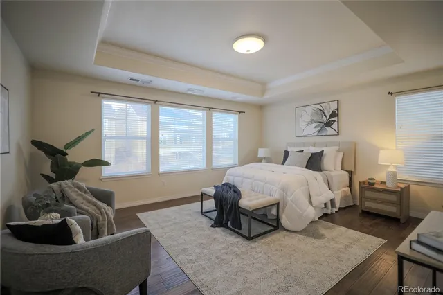 a spacious bathroom with a granite countertop tub sink and mirror