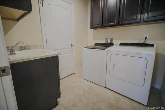 a spacious bedroom with a bed and wooden floor