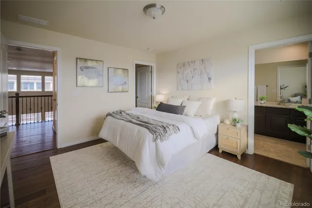 a bathroom with a double vanity sink toilet and shower