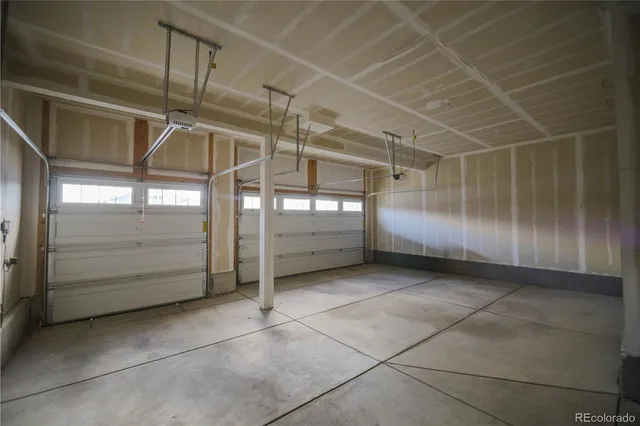 a living room filled with furniture and wooden floor