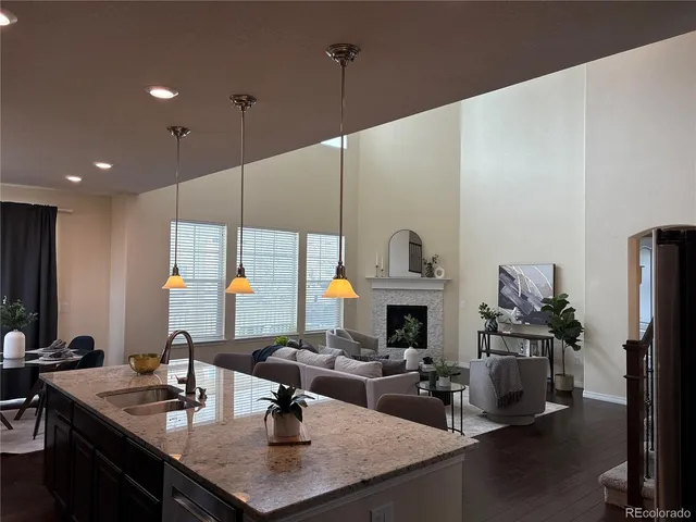 a kitchen with stainless steel appliances a sink a stove and a refrigerator