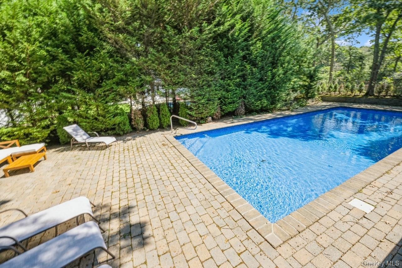 292 Little Fresh Pond Road Southampton, NY 11968 - Photo 40 of 46 View Of Heated Lap Pool Featuring A Patio Area