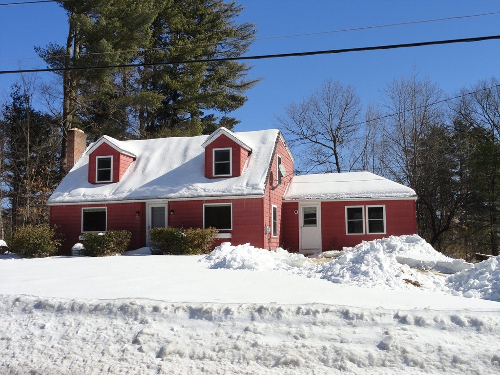 8 Scales Lane, Unit 1 Townsend, MA 01469 - Photo 1 of 20 a front view of a house with a yard