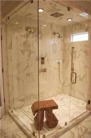 970 South Ridge Trail Clarksville, TN 37043 - Photo 3 of 20 The Opulent Master Bath is Covered in Marble. The Shower is a Custom Frameless Glass Enclosure, and Features a Kohler DTV Shower System.