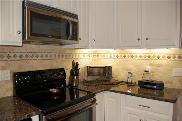 970 South Ridge Trail Clarksville, TN 37043 - Photo 6 of 20 A Closer View of the Tile Backsplash, as well as Stainless Appliances. This Kitchen has Ample Cabinet and Counter Space!