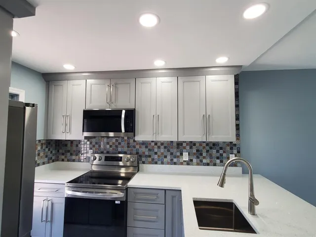 a bathroom with a sink and mirror