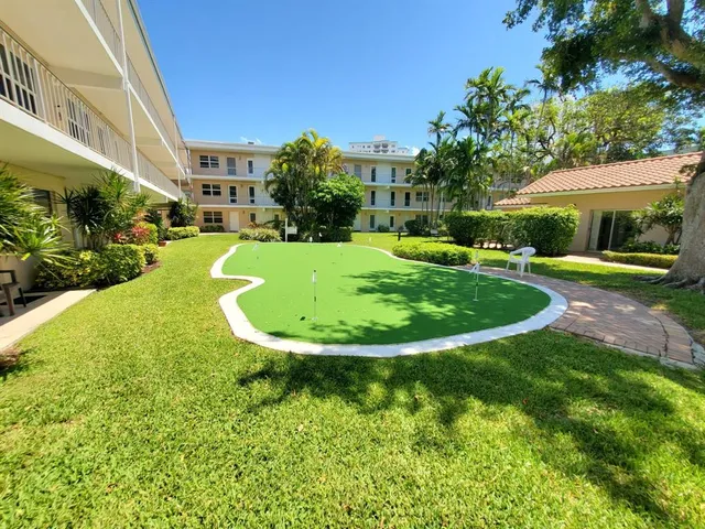 a bathroom with a sink vanity mirror and toilet