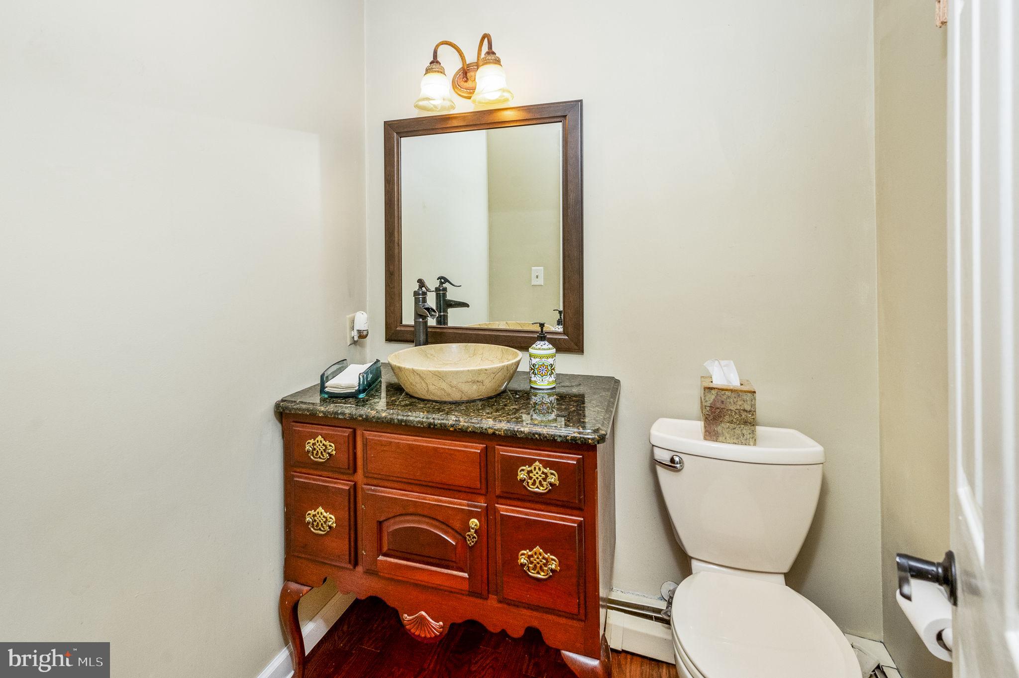 1311 Temple Road Pottstown, PA 19465 - Photo 21 of 49 a bathroom with a toilet a sink and mirror