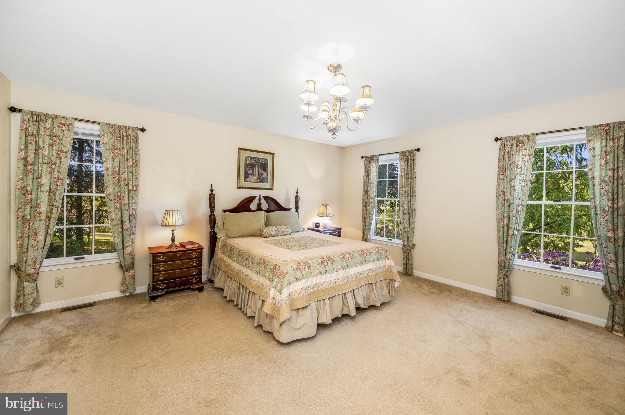 1311 Temple Road Pottstown, PA 19465 - Photo 24 of 49 a spacious bedroom with a bed and a large window