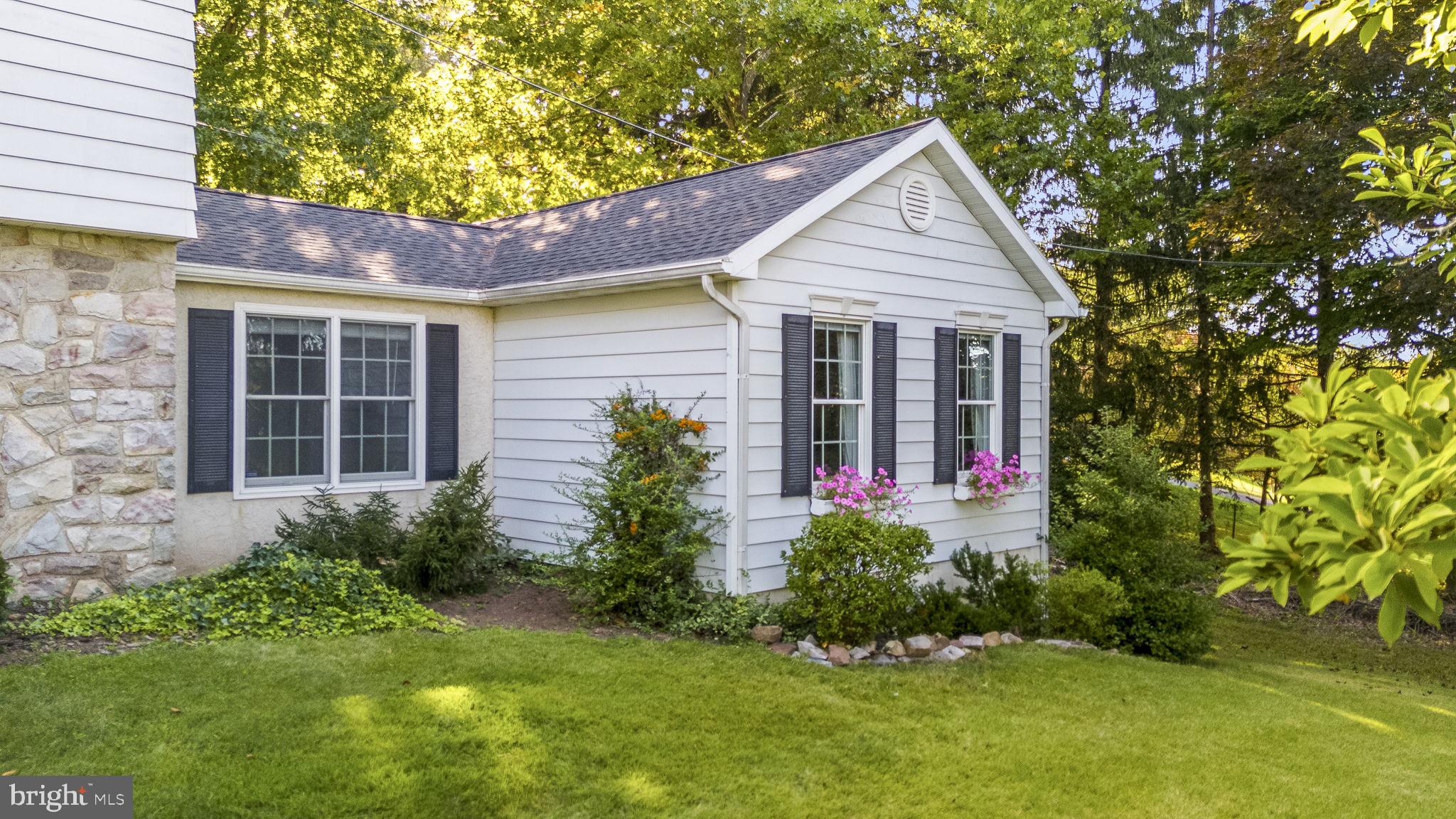 1311 Temple Road Pottstown, PA 19465 - Photo 3 of 49 a front view of a house with plants and garden