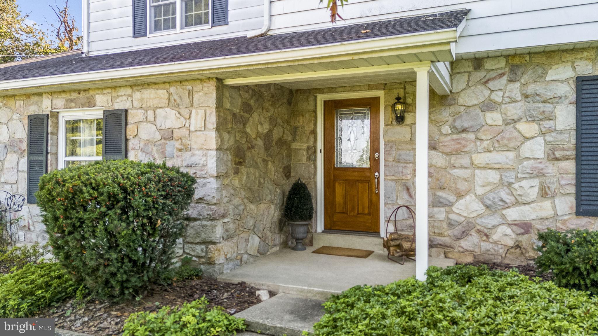 1311 Temple Road Pottstown, PA 19465 - Photo 41 of 49 a front view of a building with a garden