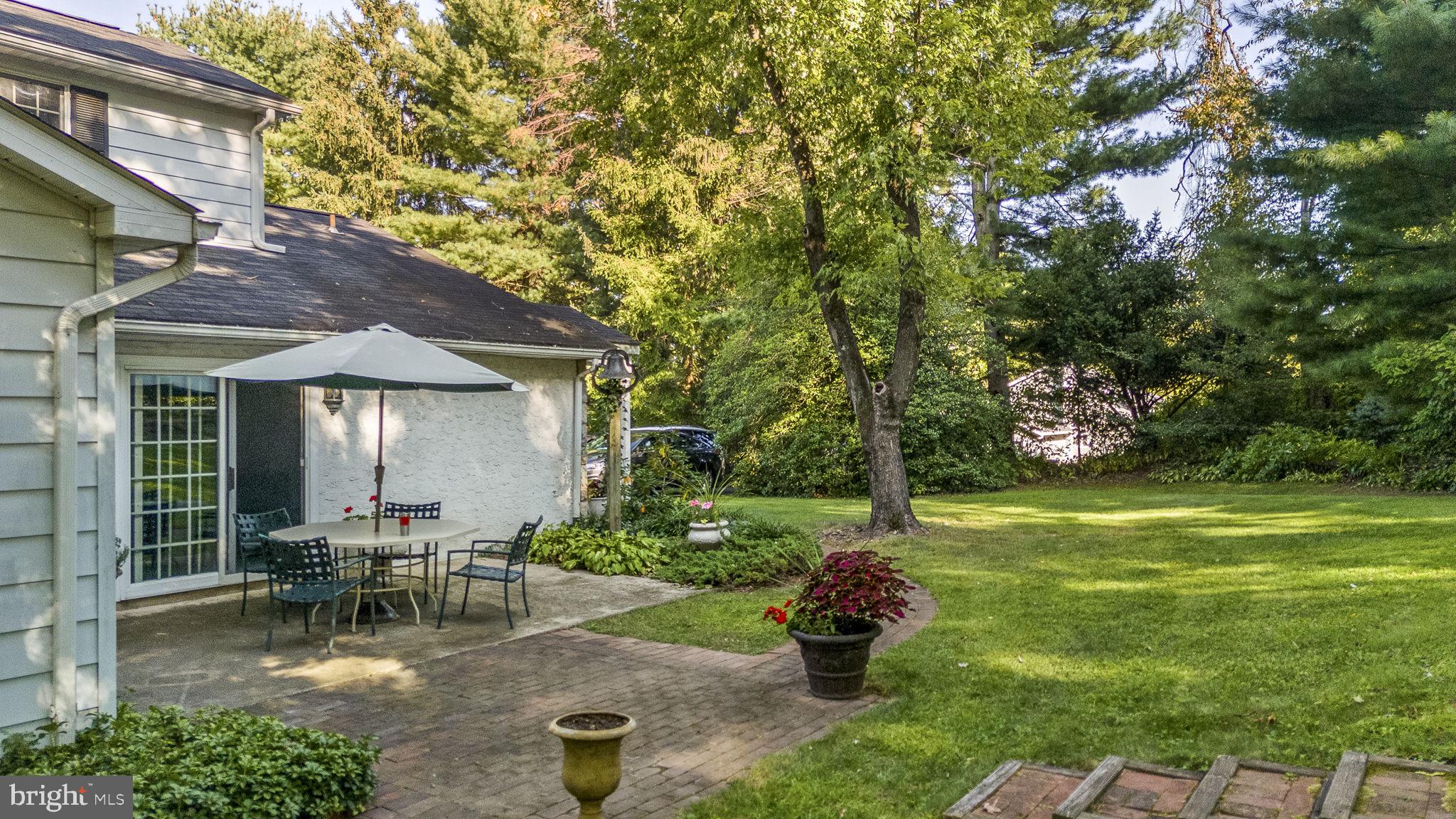 1311 Temple Road Pottstown, PA 19465 - Photo 43 of 49 a chair and table sitting in backyard of house