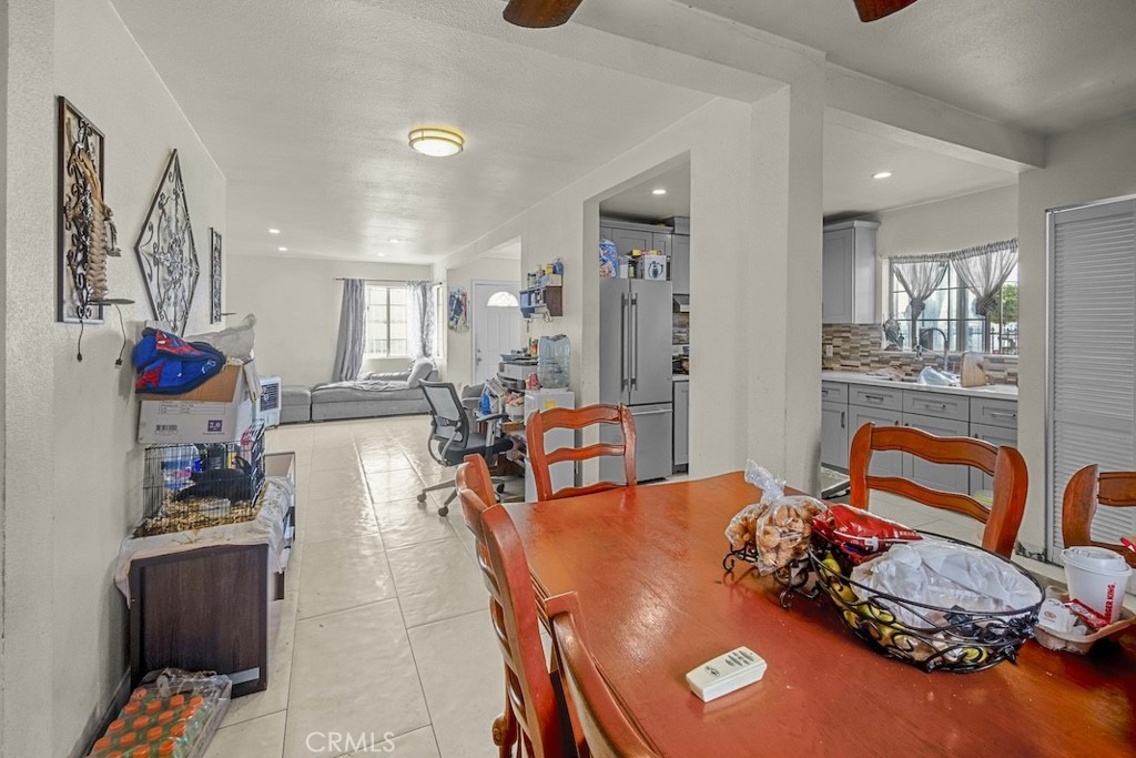 116 North Holly Avenue Compton, CA 90221 - Photo 11 of 23 a living room with furniture and a flat screen tv