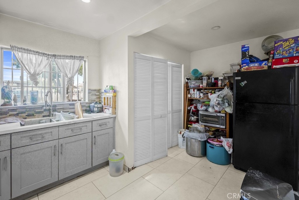 116 North Holly Avenue Compton, CA 90221 - Photo 15 of 23 a room with storage and utility