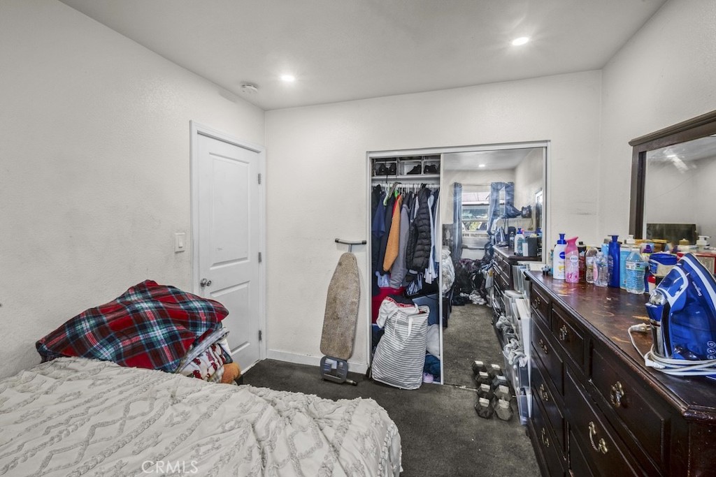 116 North Holly Avenue Compton, CA 90221 - Photo 18 of 23 a bedroom with a bed and a closet