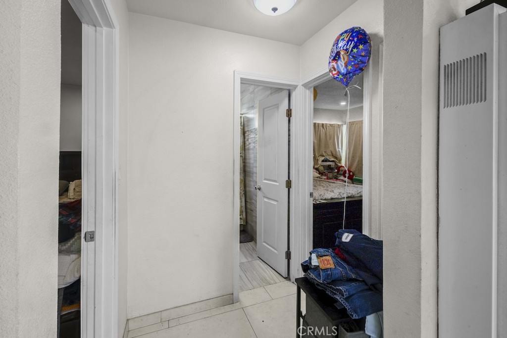 116 North Holly Avenue Compton, CA 90221 - Photo 19 of 23 a bathroom with a mirror and a shower