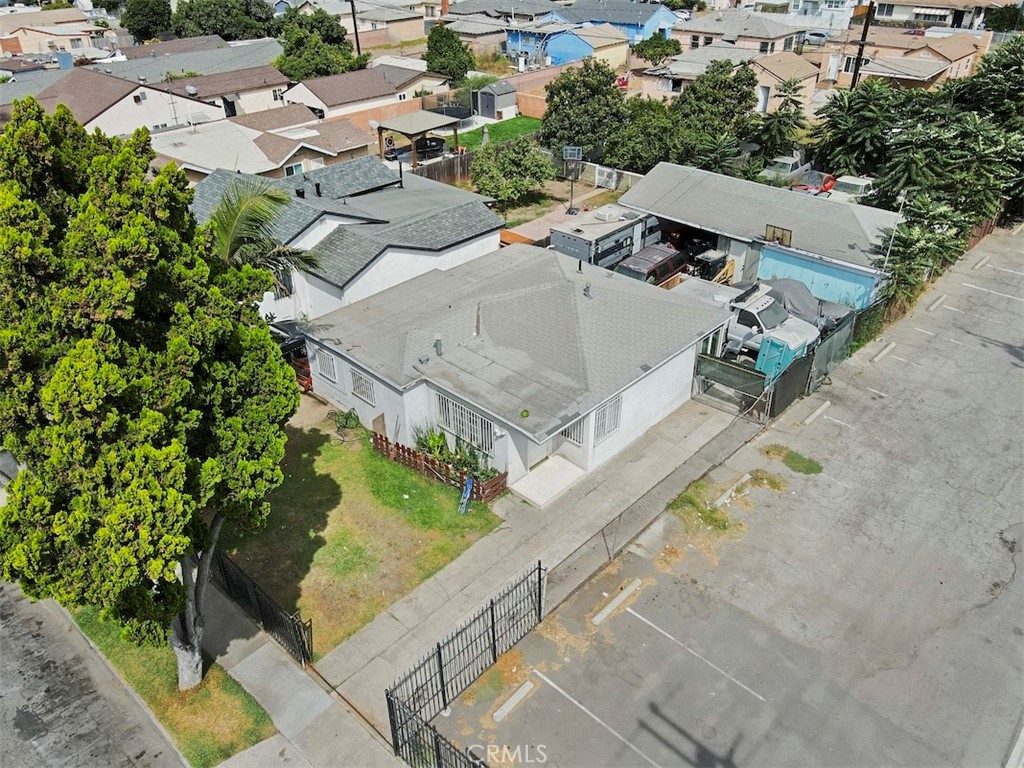 116 North Holly Avenue Compton, CA 90221 - Photo 2 of 23 an aerial view of a house with a yard and lake view
