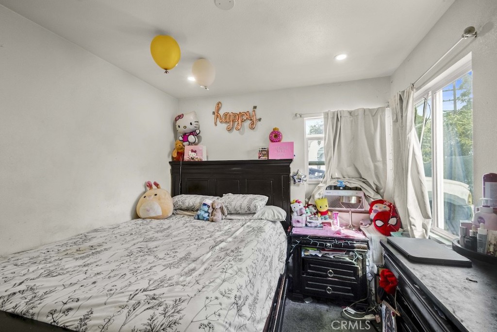 116 North Holly Avenue Compton, CA 90221 - Photo 21 of 23 a bedroom with a bed and a window