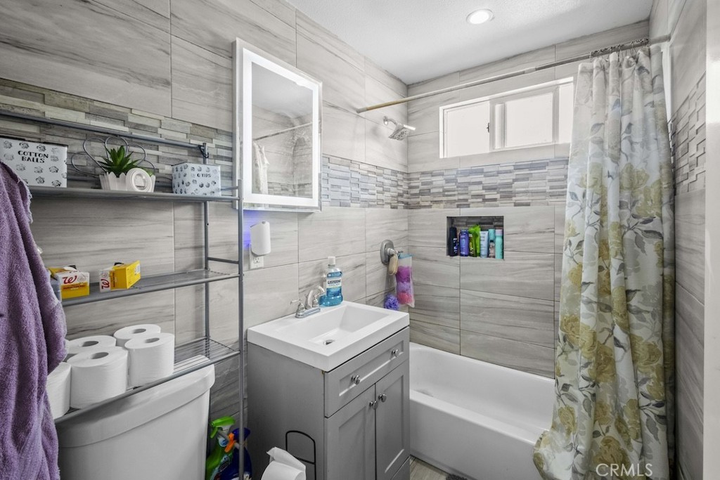 116 North Holly Avenue Compton, CA 90221 - Photo 22 of 23 a bathroom with a sink toilet and shower