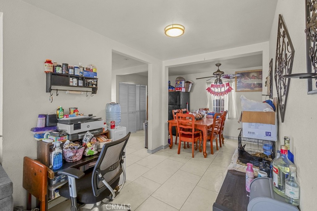 116 North Holly Avenue Compton, CA 90221 - Photo 9 of 23 a view of a dining room with furniture and toys