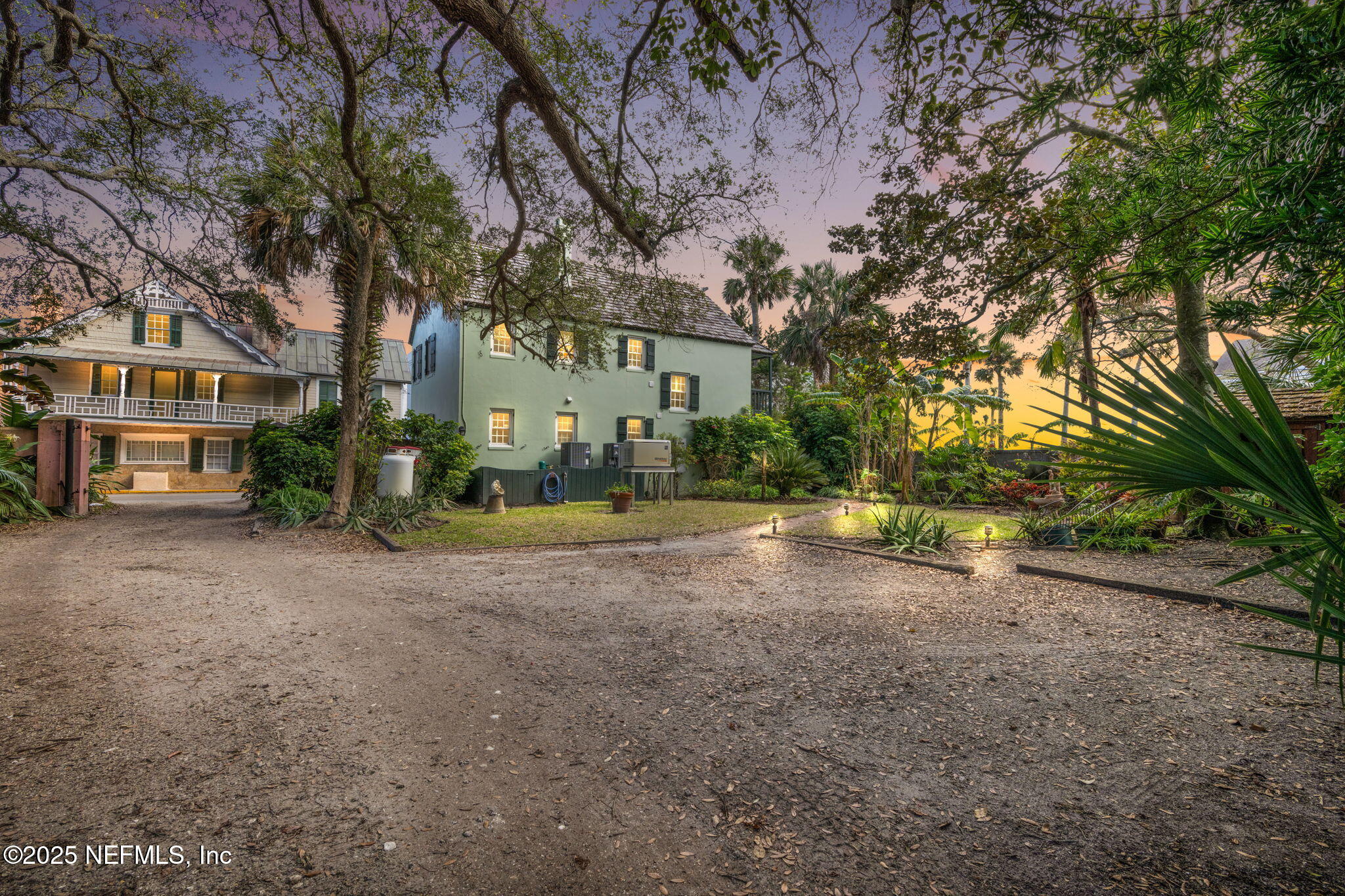76 Marine Street St. Augustine, FL 32084 - Photo 1 of 60 a view of a house with a tree in the background