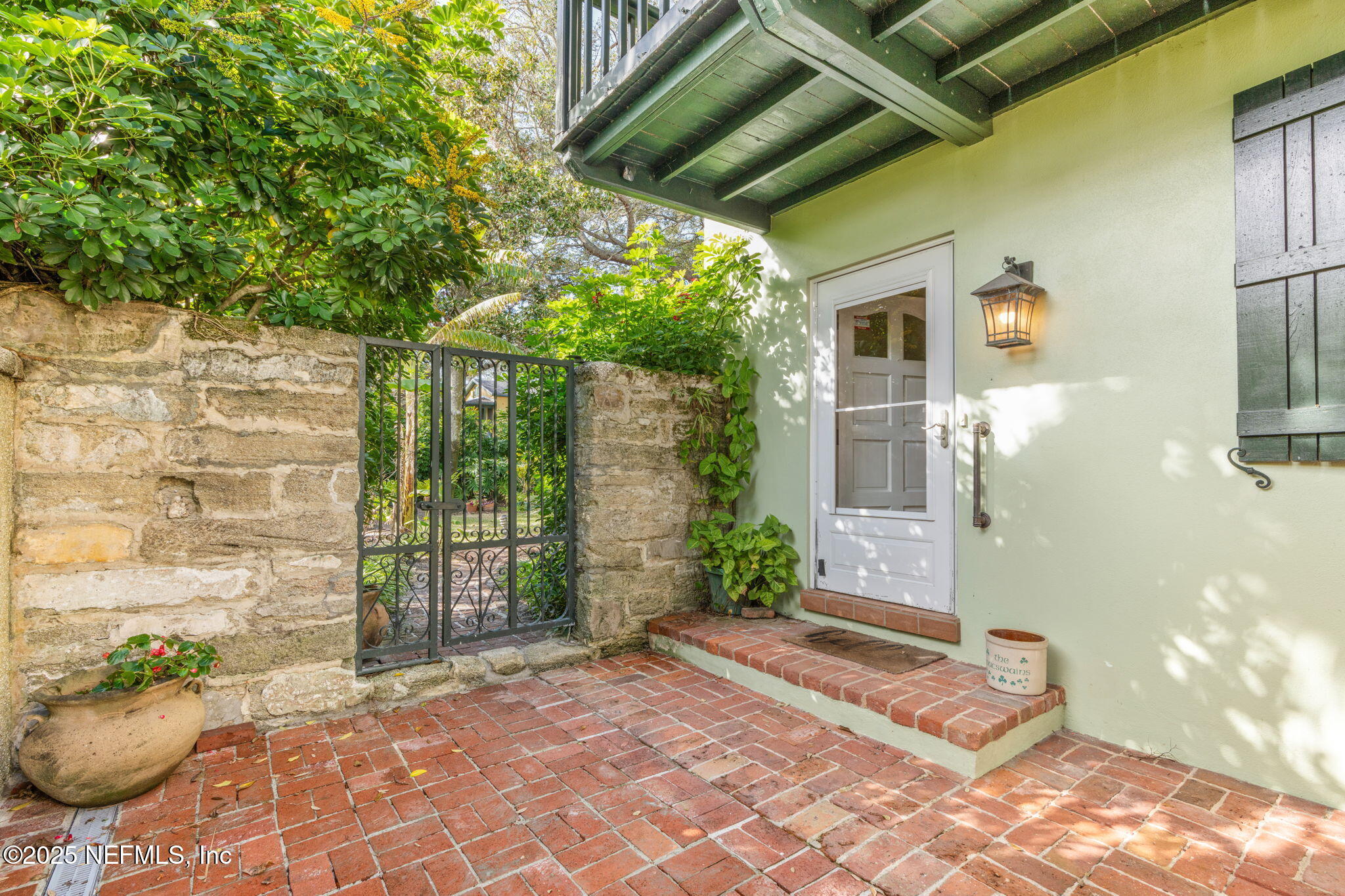 76 Marine Street St. Augustine, FL 32084 - Photo 11 of 60 a front view of a house with a yard
