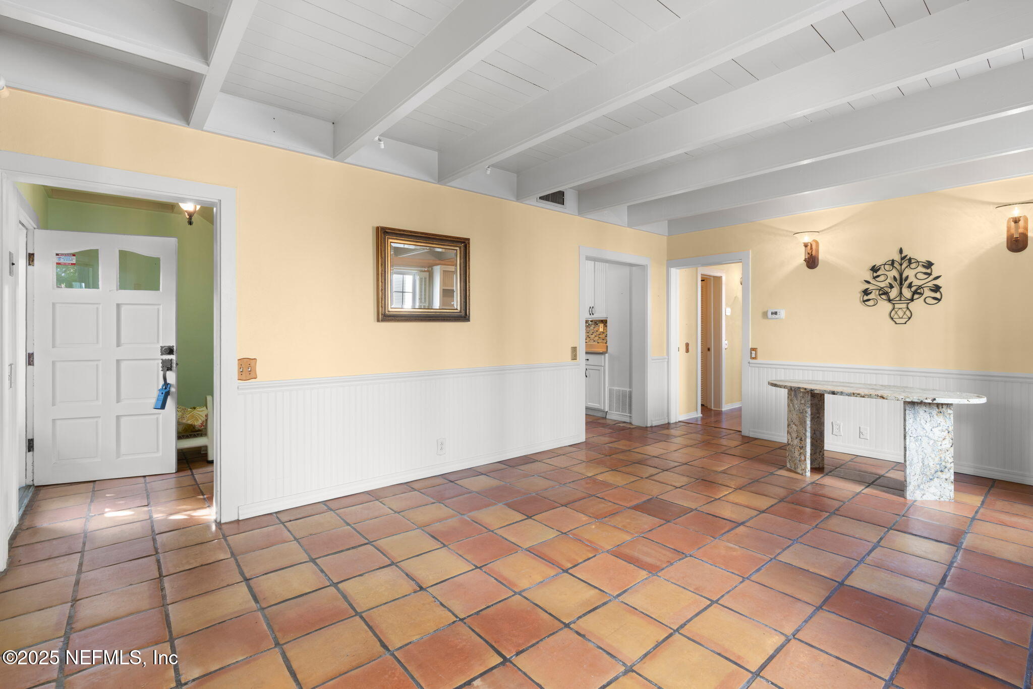76 Marine Street St. Augustine, FL 32084 - Photo 15 of 60 a view of a livingroom with wooden floor and a refrigerator